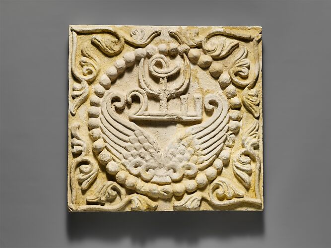 Wall panel with wings and a Pahlavi device encircled by pearls