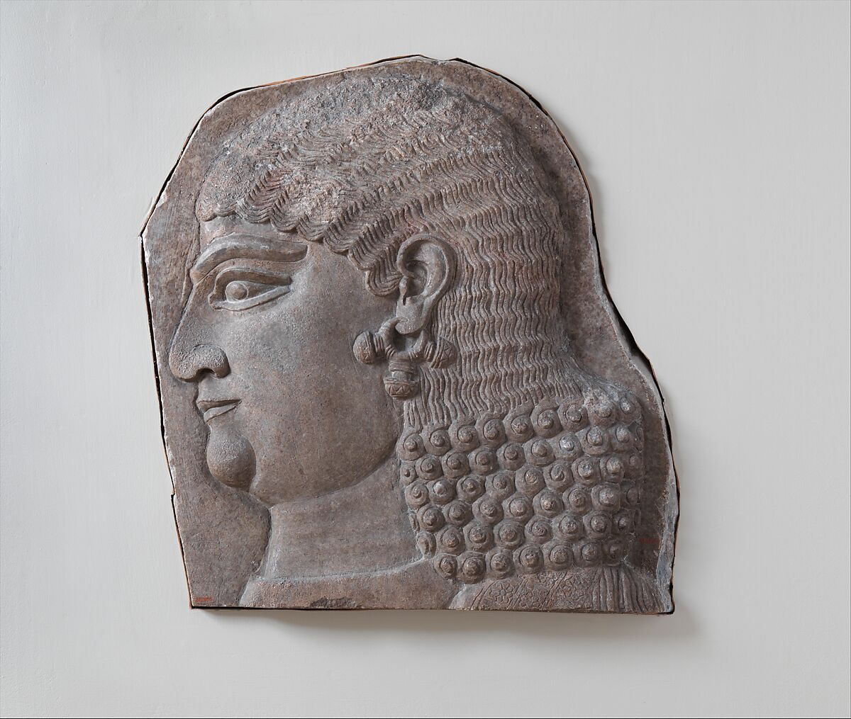 Head of a beardless royal attendant, possibly a eunuch, Gypsum alabaster, Assyrian 