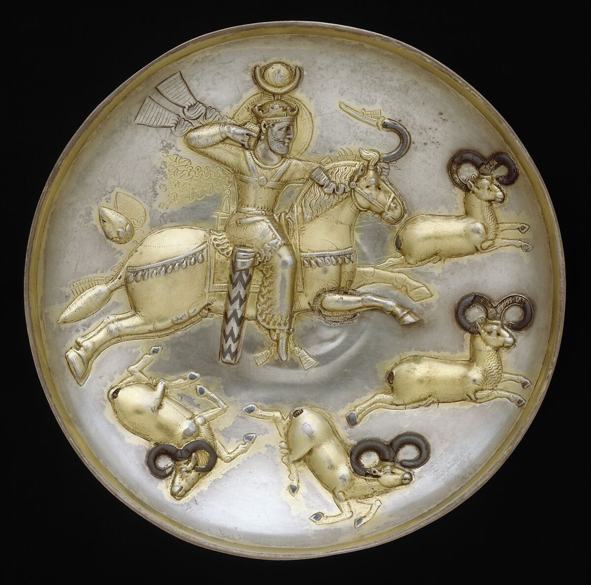 Plate with king hunting rams, Silver, mercury gilding, niello inlay, Sasanian 