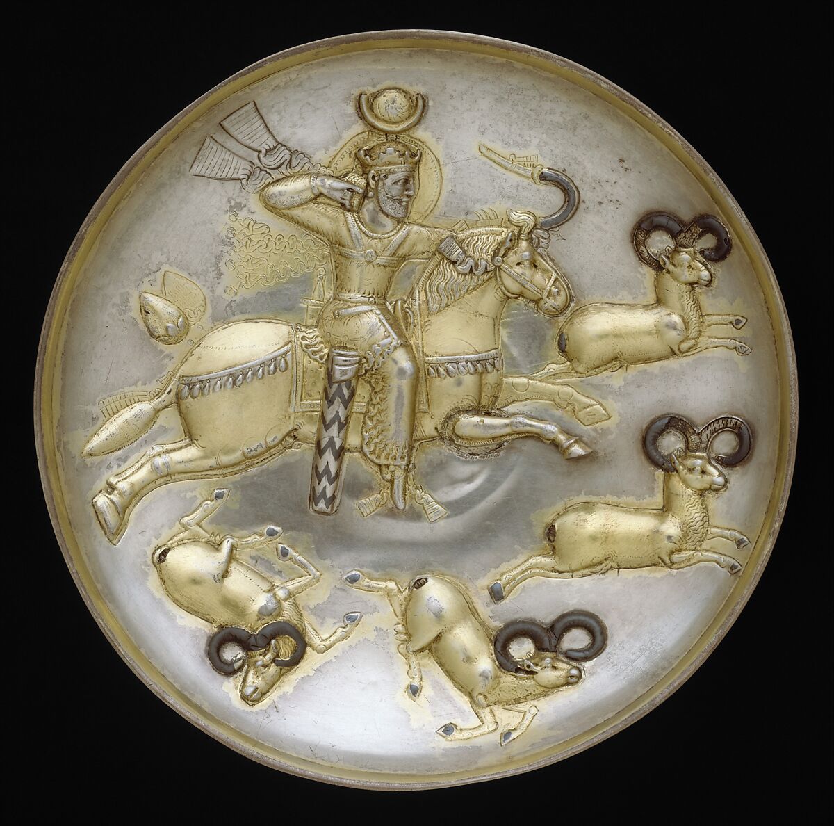 Plate with king hunting rams, Silver, mercury gilding, niello inlay, Sasanian