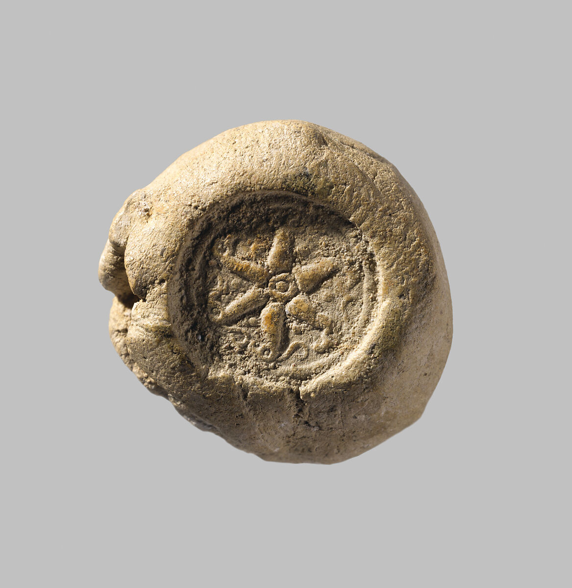 Sealing with stamp seal impressions: radiating griffins; banquet scene