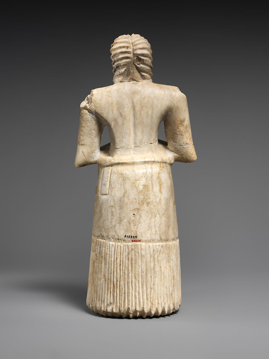 Standing male worshiper, Gypsum alabaster, shell, black limestone, bitumen, Sumerian
