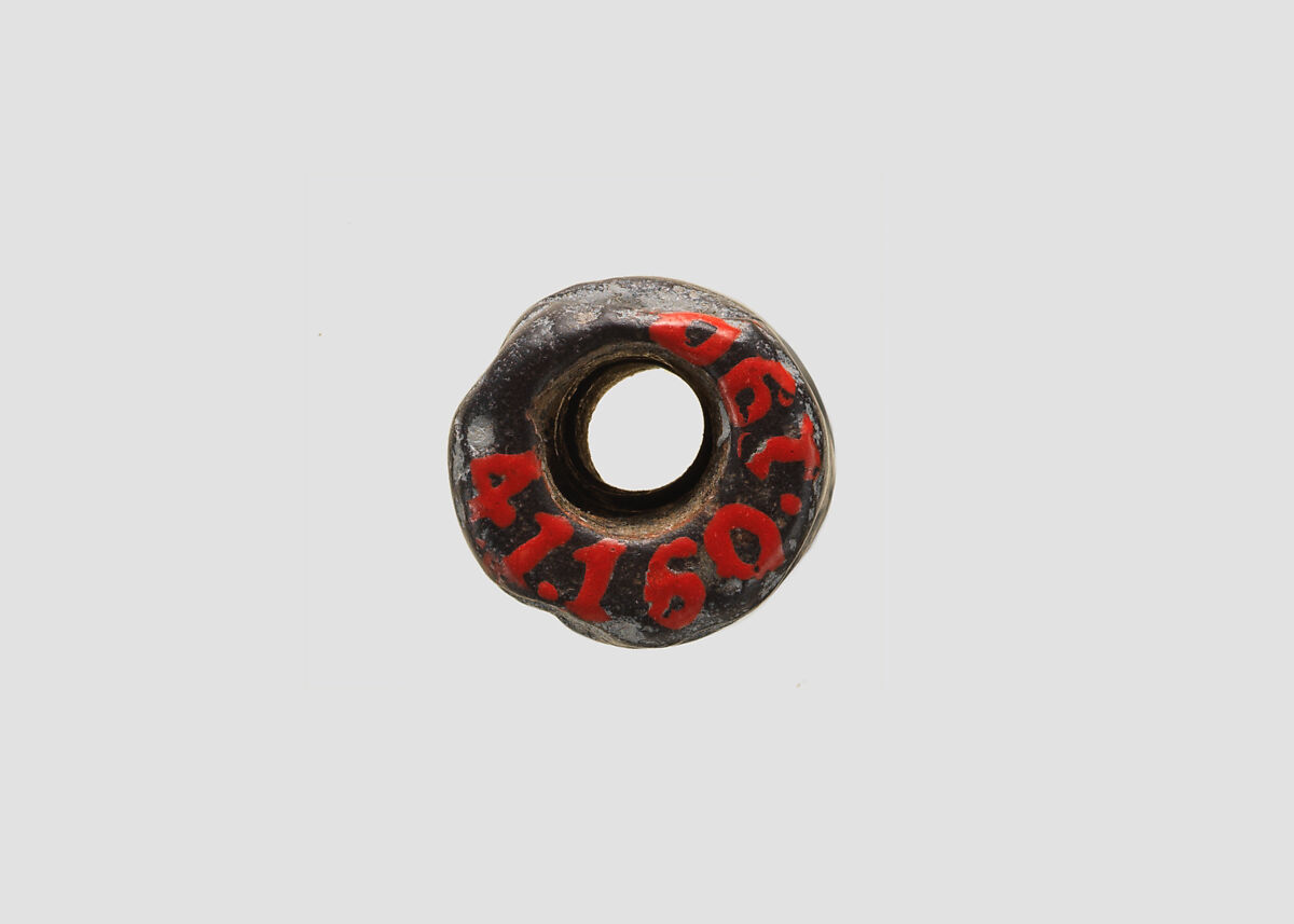 Cylinder seal and modern impression: nude goddess faces a male figure; worshiper, Hematite