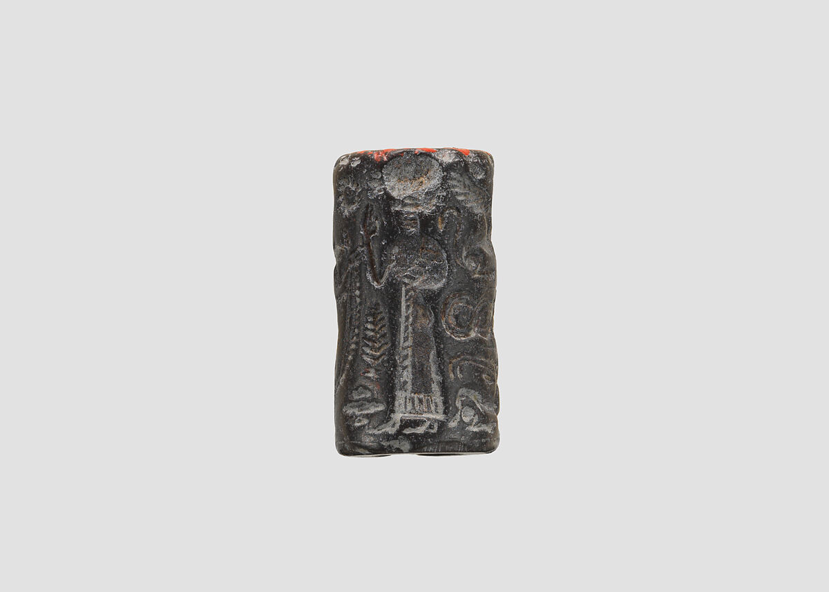 Cylinder seal and modern impression: nude goddess faces a male figure; worshiper, Hematite