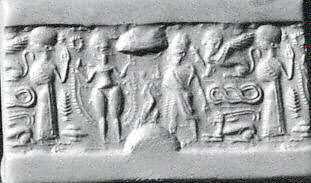 Cylinder seal and modern impression: nude goddess faces a male figure; worshiper, Hematite 