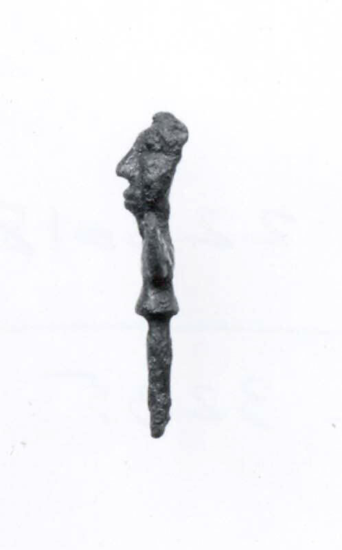 Head of a pin: human head and wings, Bronze, Iran 