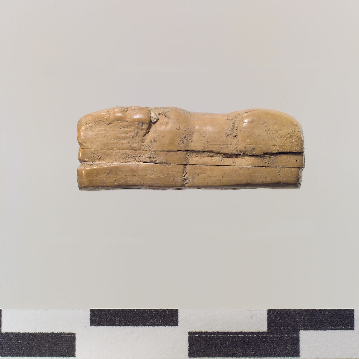 Figure of crouching lion, Ivory, Iran