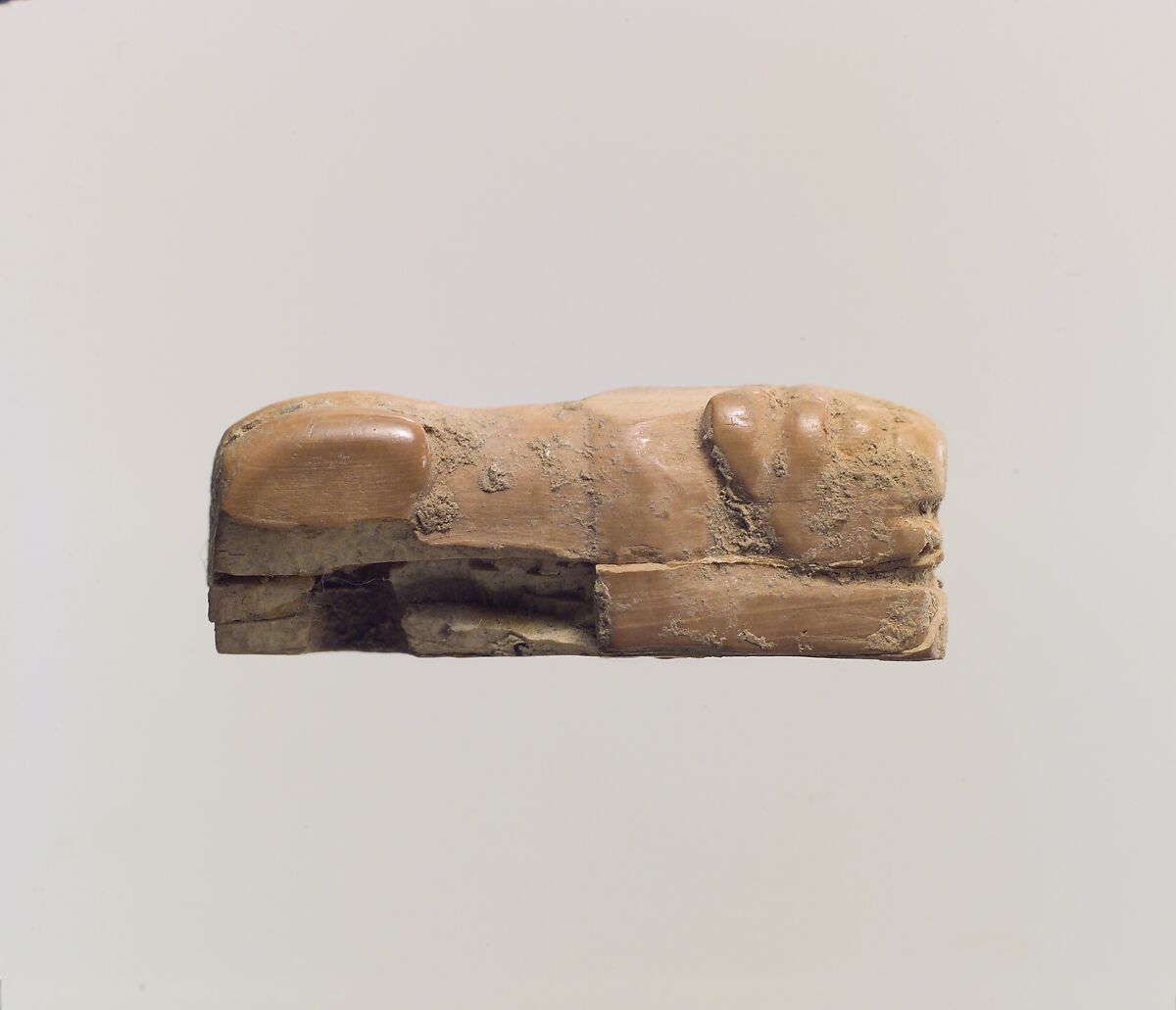 Figure of crouching lion, Ivory, Iran 