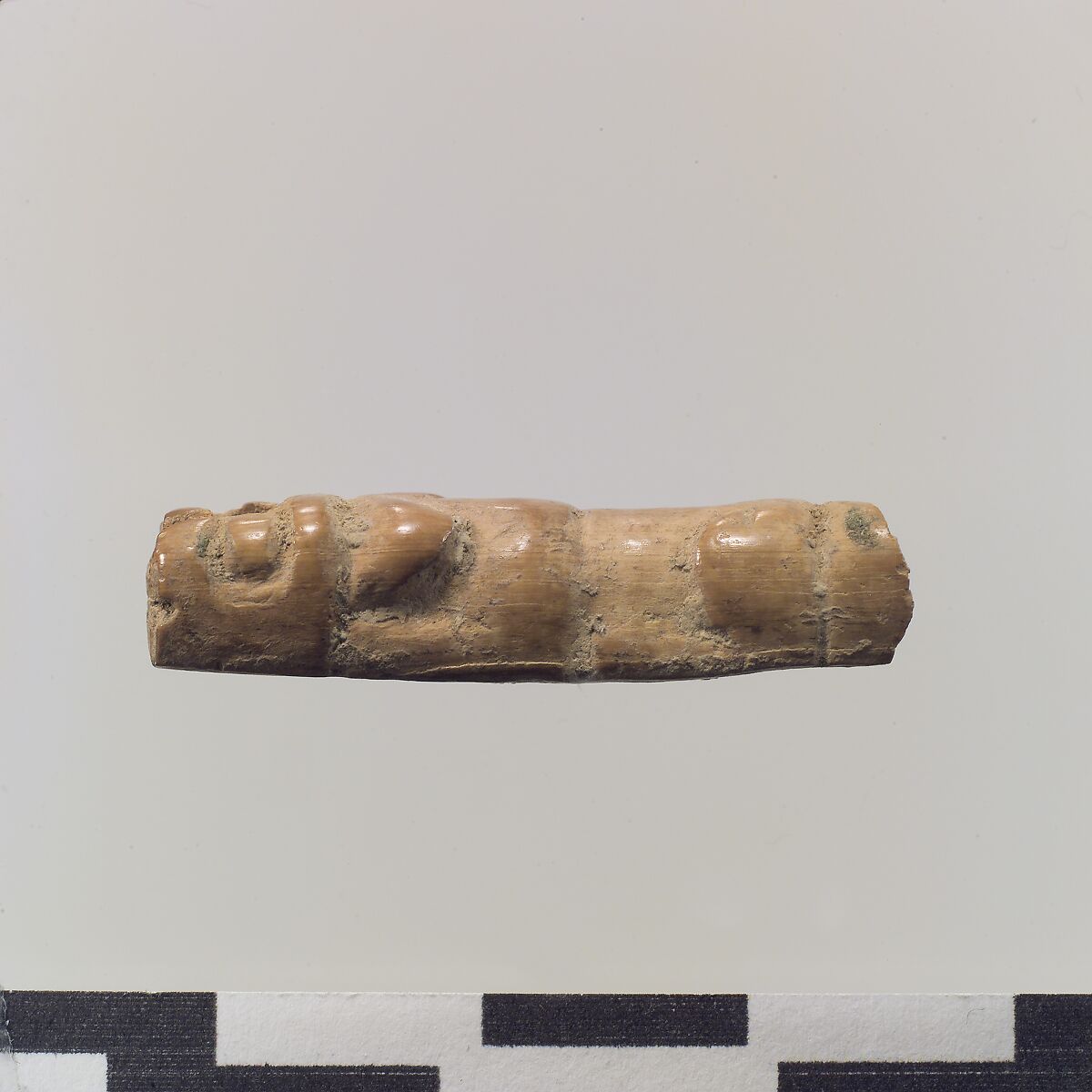 Figure of crouching lion, Ivory, Iran