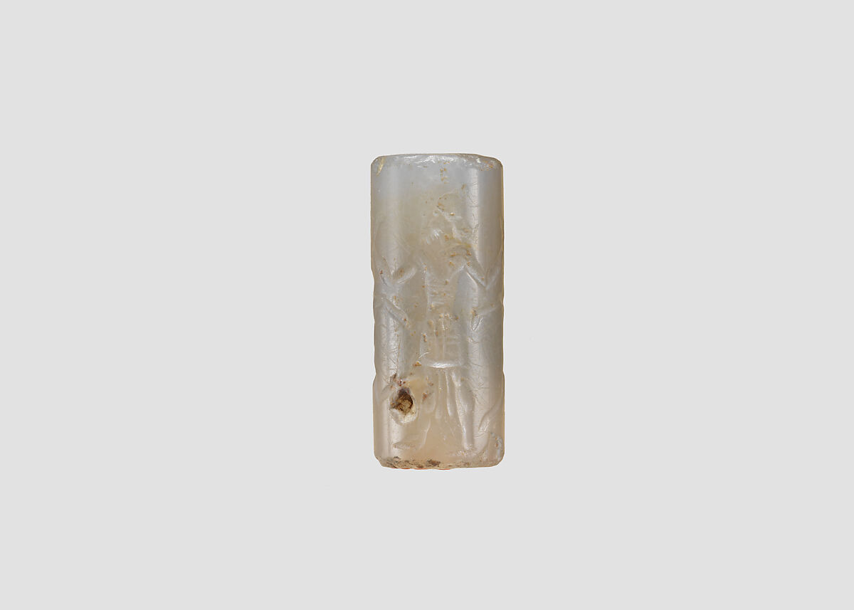Cylinder seal and modern impression: hero grasping two antelopes by their hind legs, Chalcedony, Assyrian