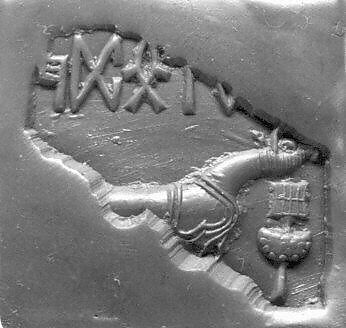 Stamp seal fragment: unicorn and incense-burner (?), inscription, Steatite, burnt, Indus 
