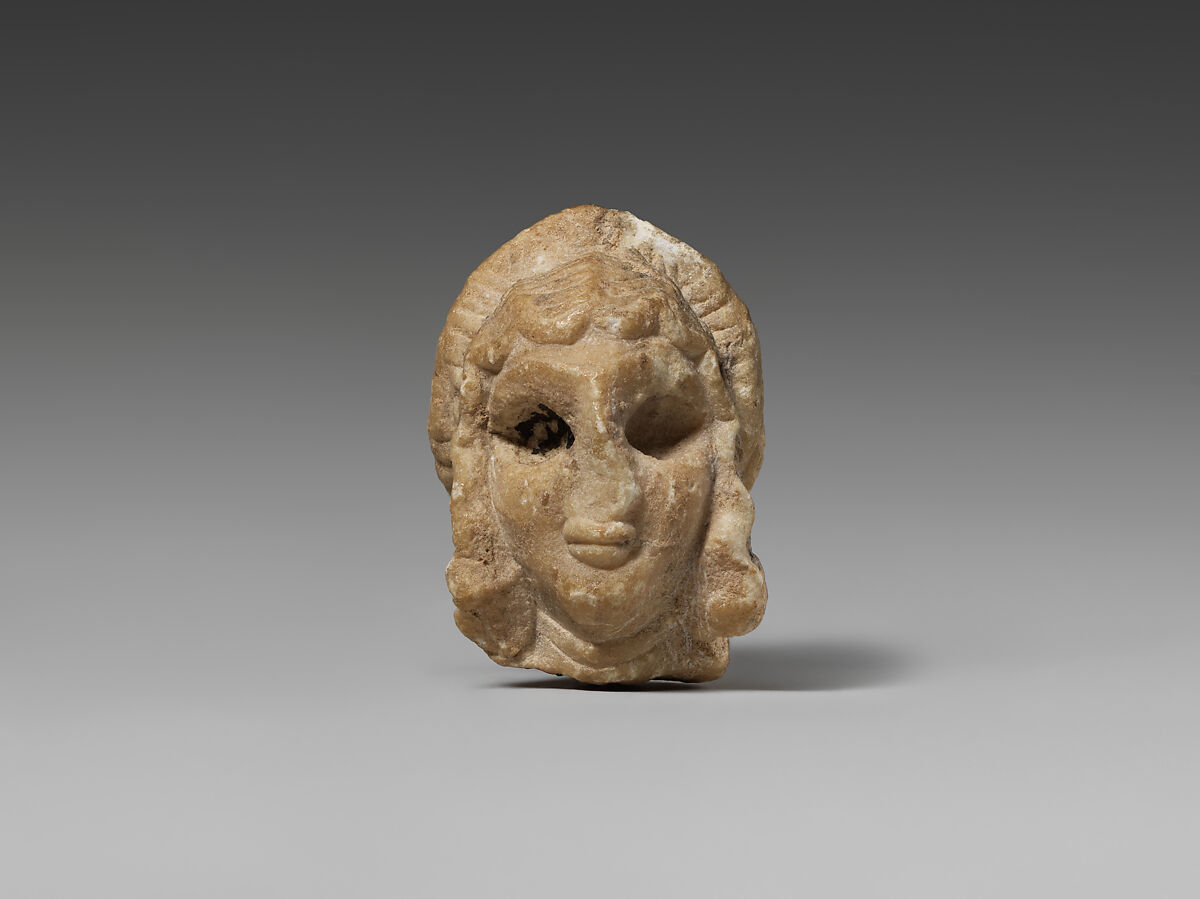 Female head with elaborate hairstyle, Gypsum alabaster 