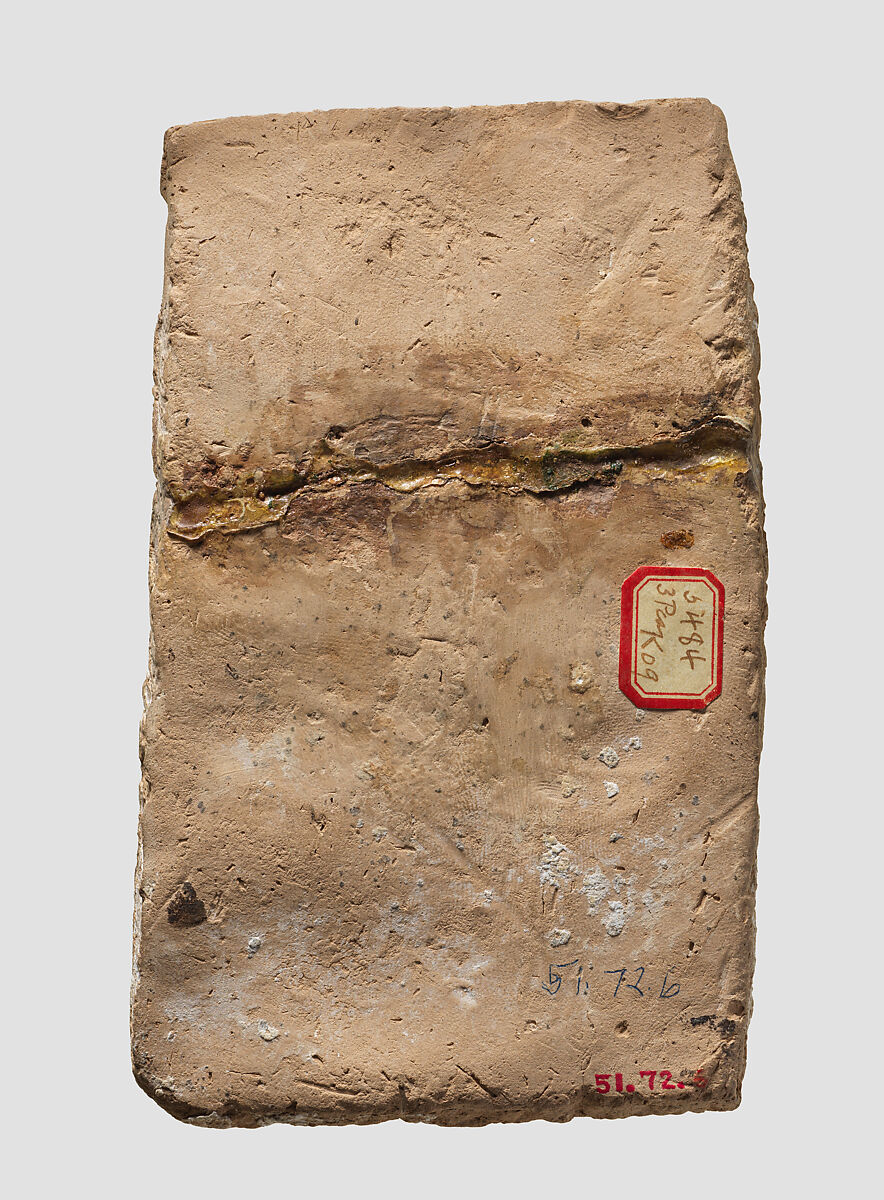 Molded plaque: eagle-headed apkallu, Ceramic, lime, bitumen, Assyrian