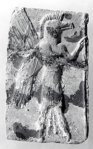 Molded plaque: eagle-headed apkallu