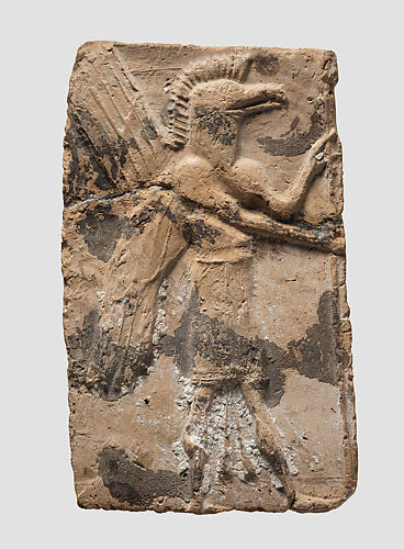 Molded plaque: eagle-headed apkallu