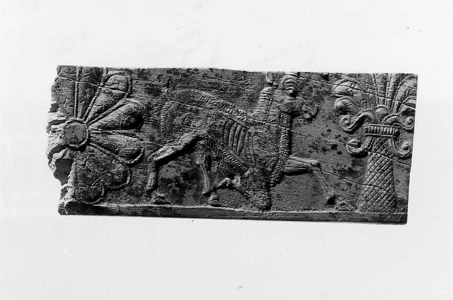 Panel fragment with a kneeling horned animal, Ivory, Iran 