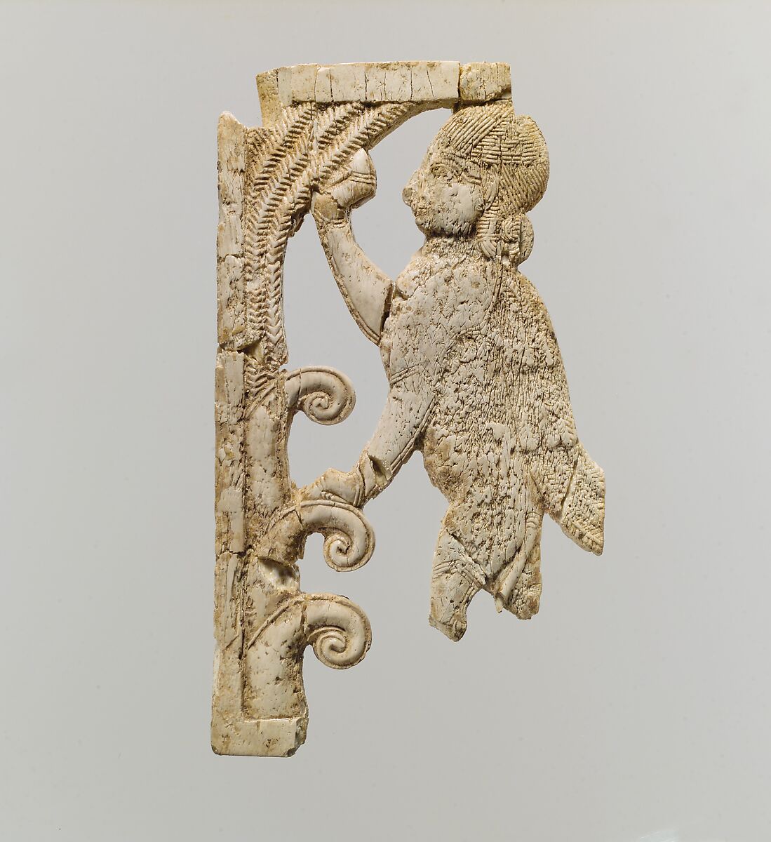 Openwork plaque with a sphinx at a tree, Ivory, Assyrian 