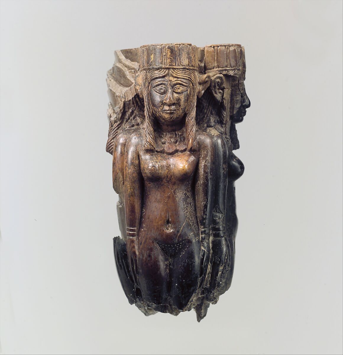 Fan or fly-whisk handle in the form of four female figures, Ivory, gold leaf, Assyrian 