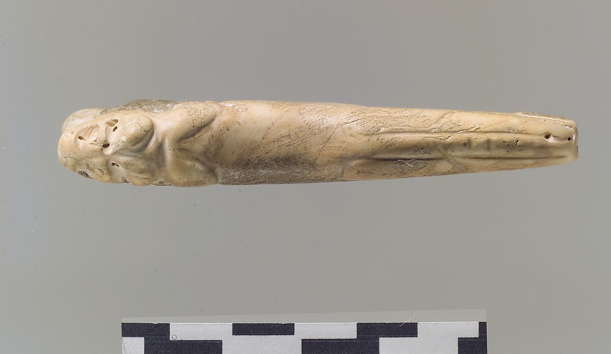 Amulet in the form of a lion with legs extended, Shell
