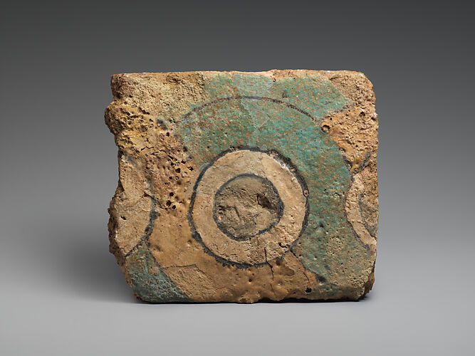 Brick fragment with a guilloche design