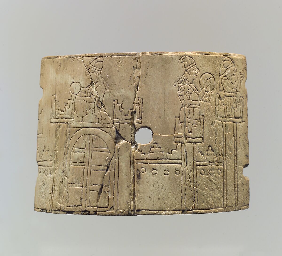 Incised cosmetic box fragments with a warrior and four women