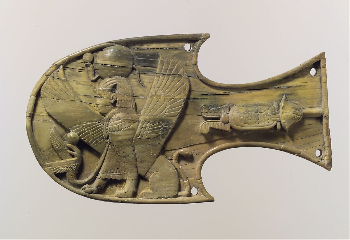 Horse blinker carved in relief with a seated sphinx, Ivory, Assyrian 