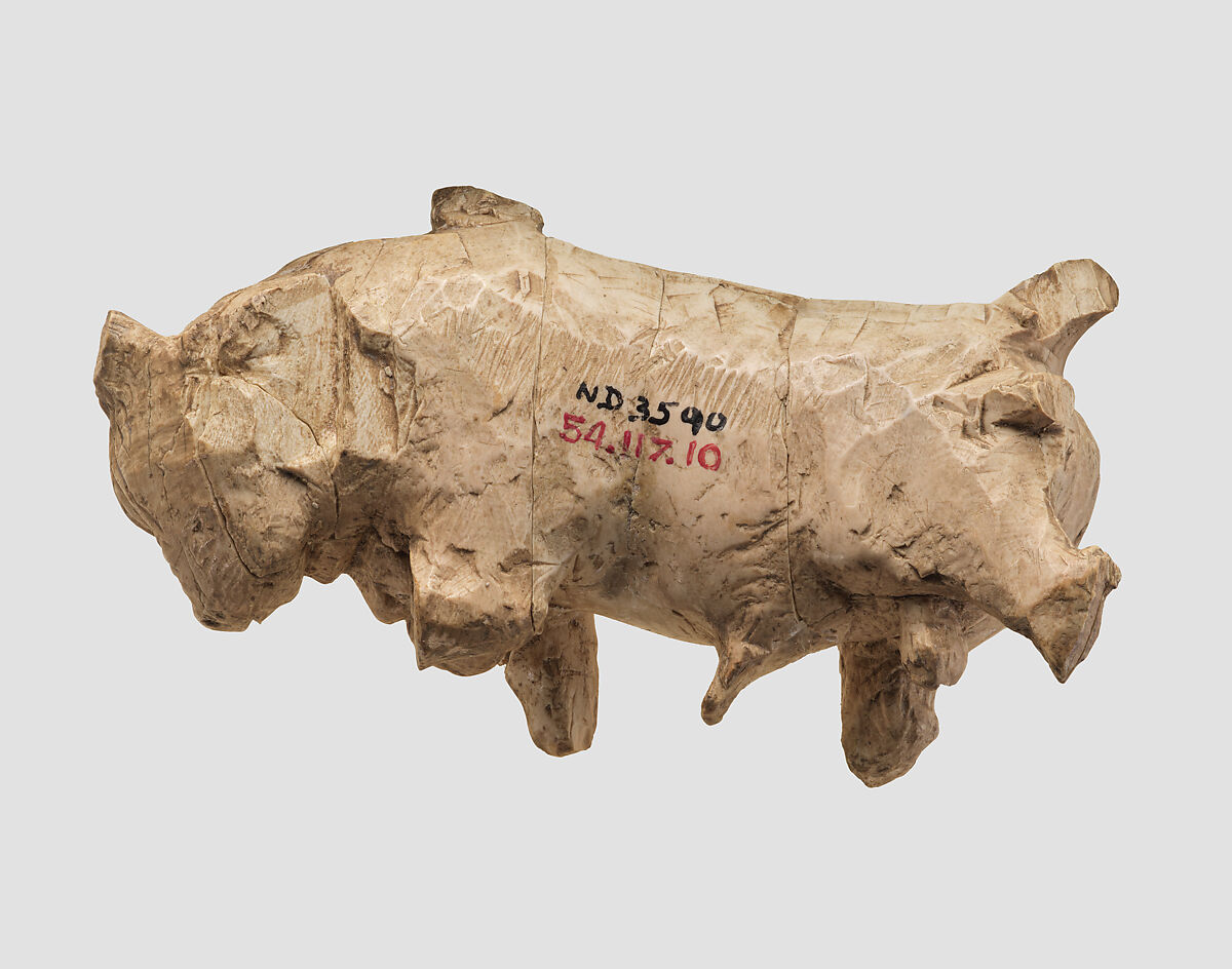 Furniture or cosmetic box plaque carved in the round with striding bull, Ivory, gold foil, Assyrian