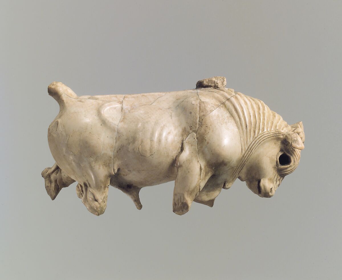 Furniture or cosmetic box plaque carved in the round with striding bull, Ivory, gold foil, Assyrian 