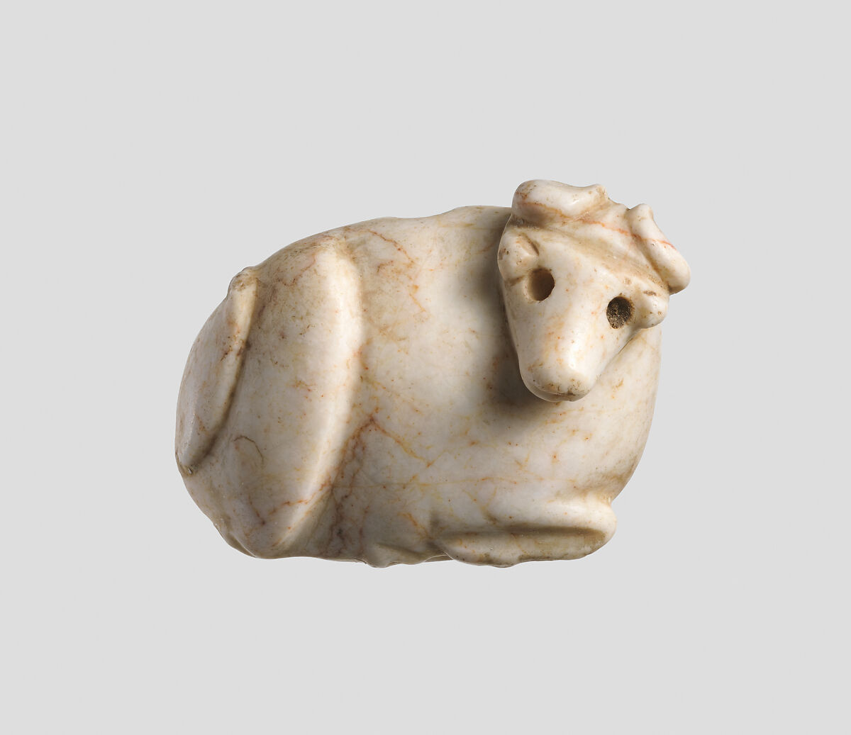 Seal amulet in the form of a reclining cow, Marble 