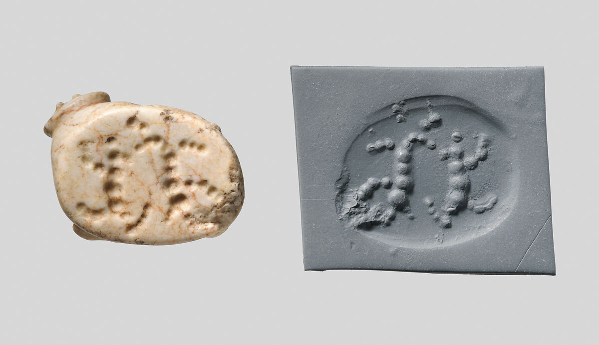 Seal amulet in the form of a reclining cow, Marble