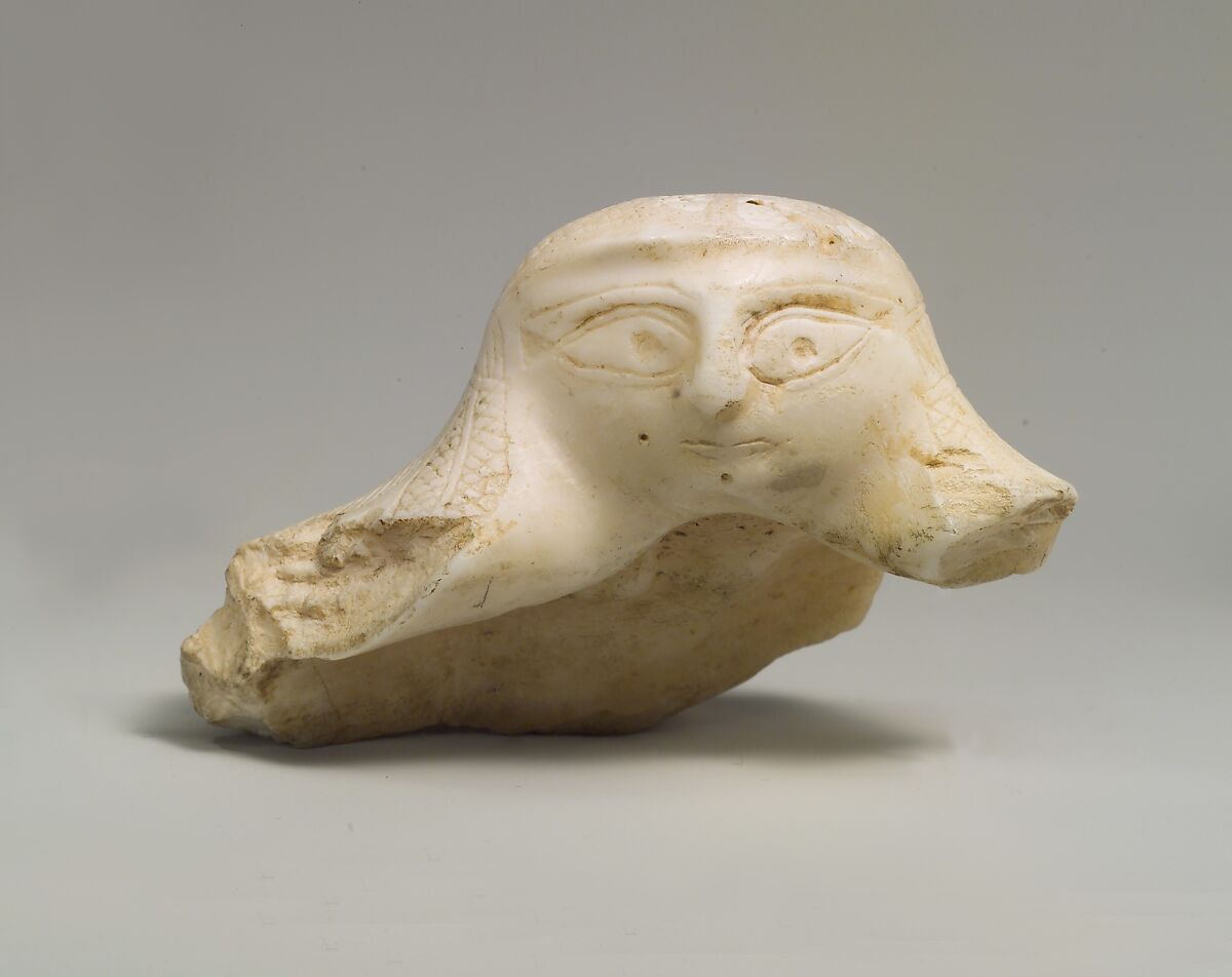 Fragment of a shell with a sculpted female head, Shell (Tridacna squamosa) 