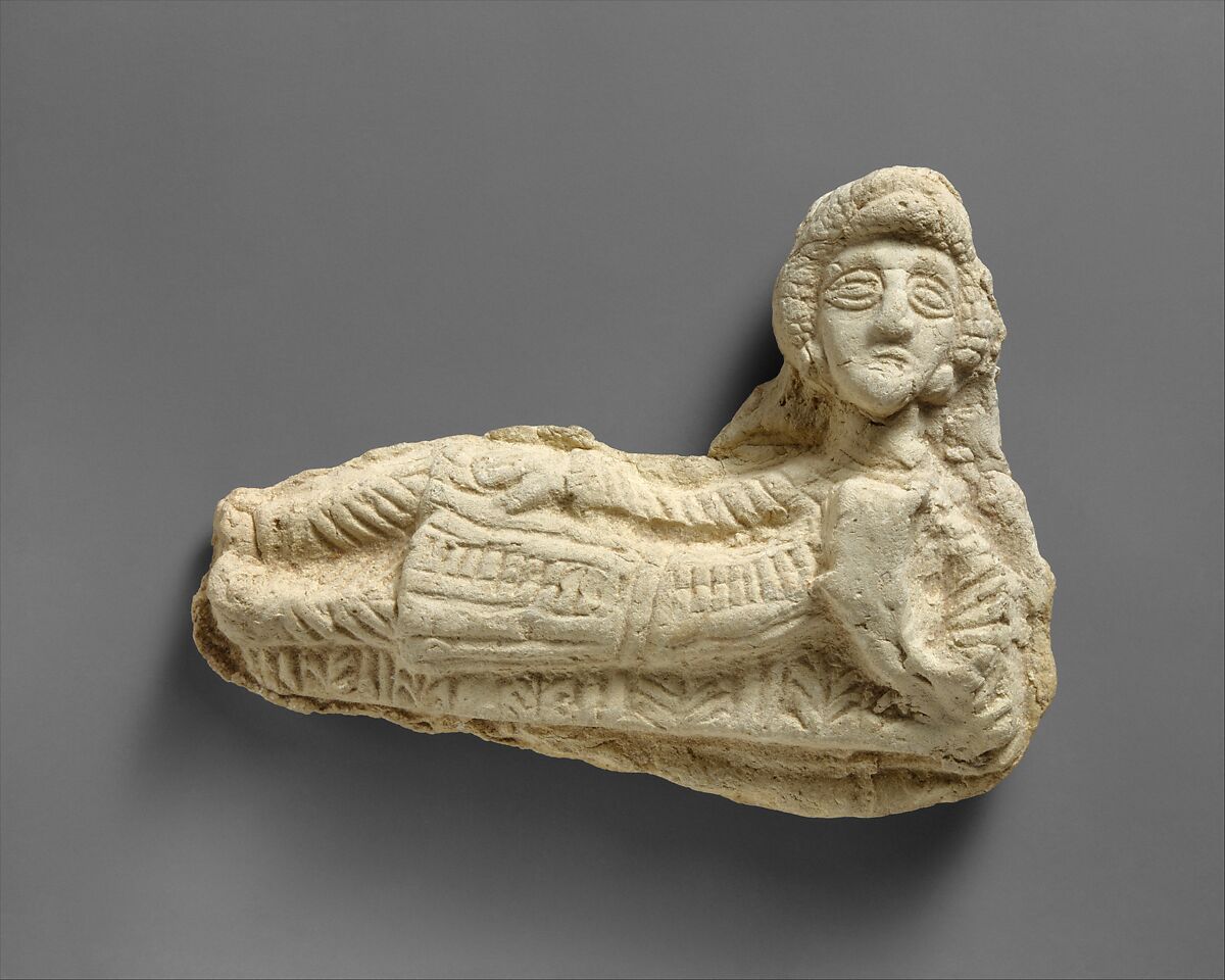 Plaque in the form of a reclining man, Ceramic, Parthian 