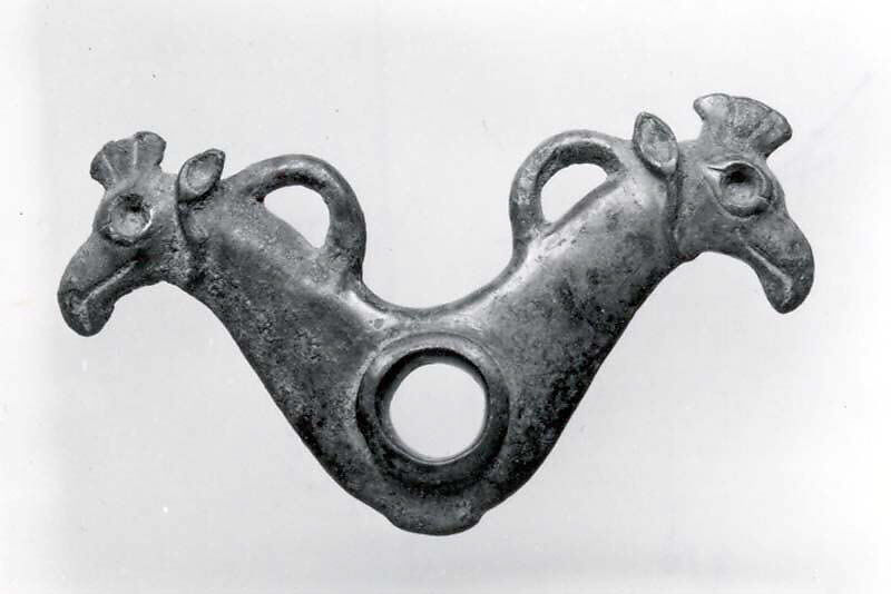 Horse bit cheekpiece in form of addorsed griffin heads, Bronze, Iran 