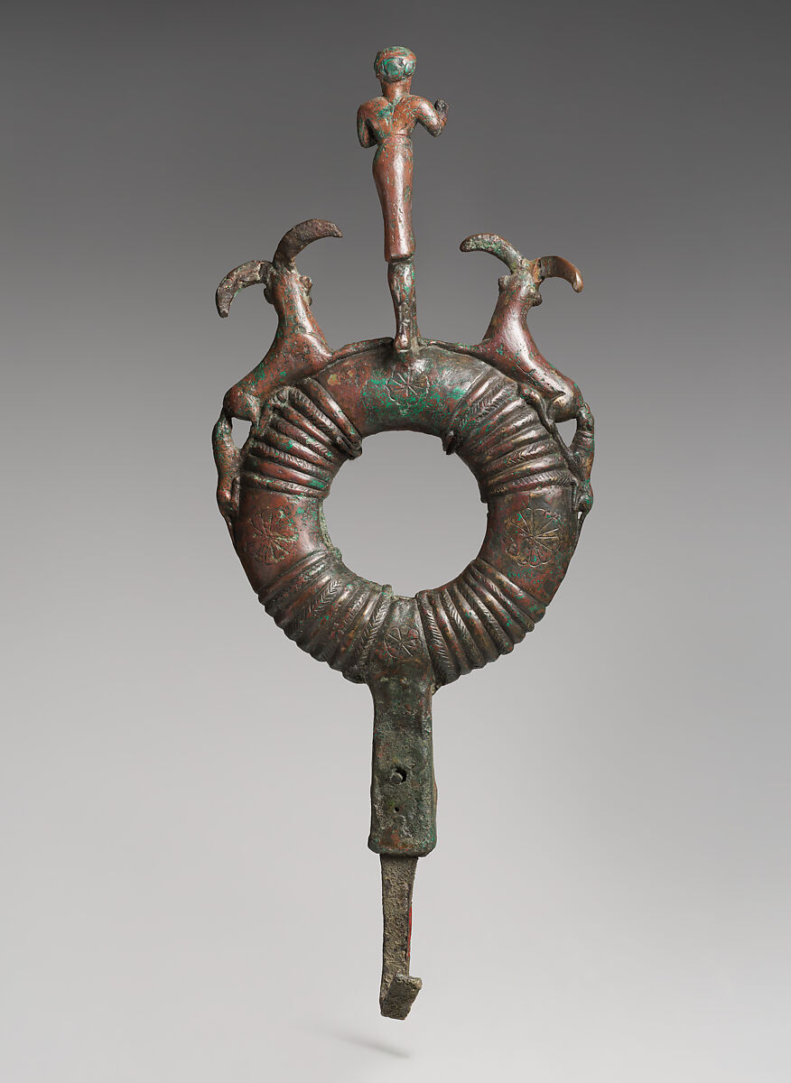 Top of standard with male figure and flanking ibexes attacked by dogs, Bronze, Elamite
