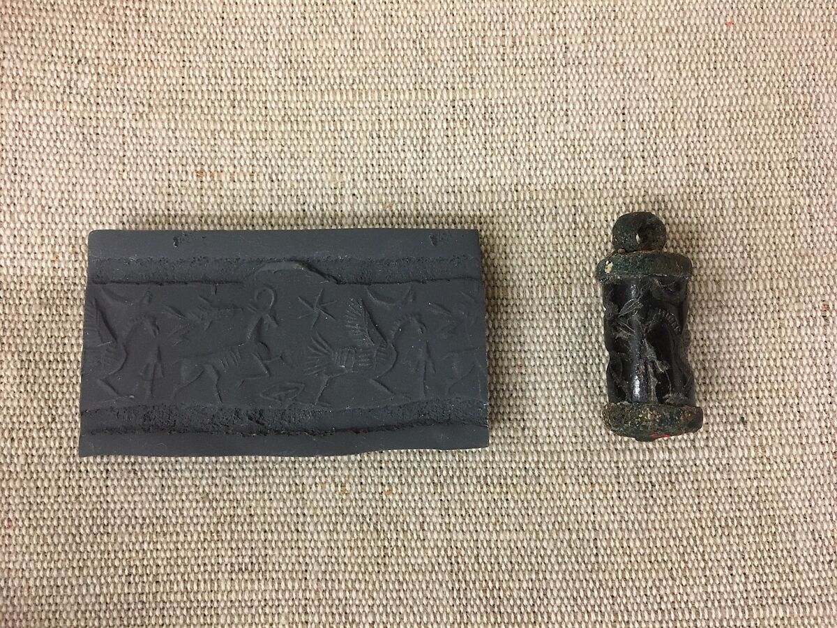Cylinder seal (with caps preserved) with animals and divine symbols, Black Steatite, copper/bronze caps, Assyrian