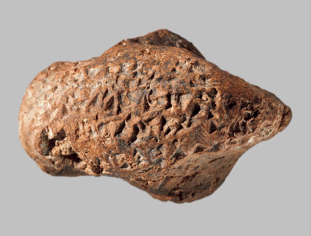 Bird head with inscription of Ashurbanipal, Ceramic, Assyrian