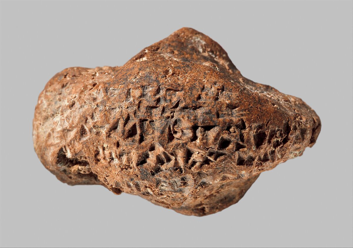 Bird head with inscription of Ashurbanipal, Ceramic, Assyrian
