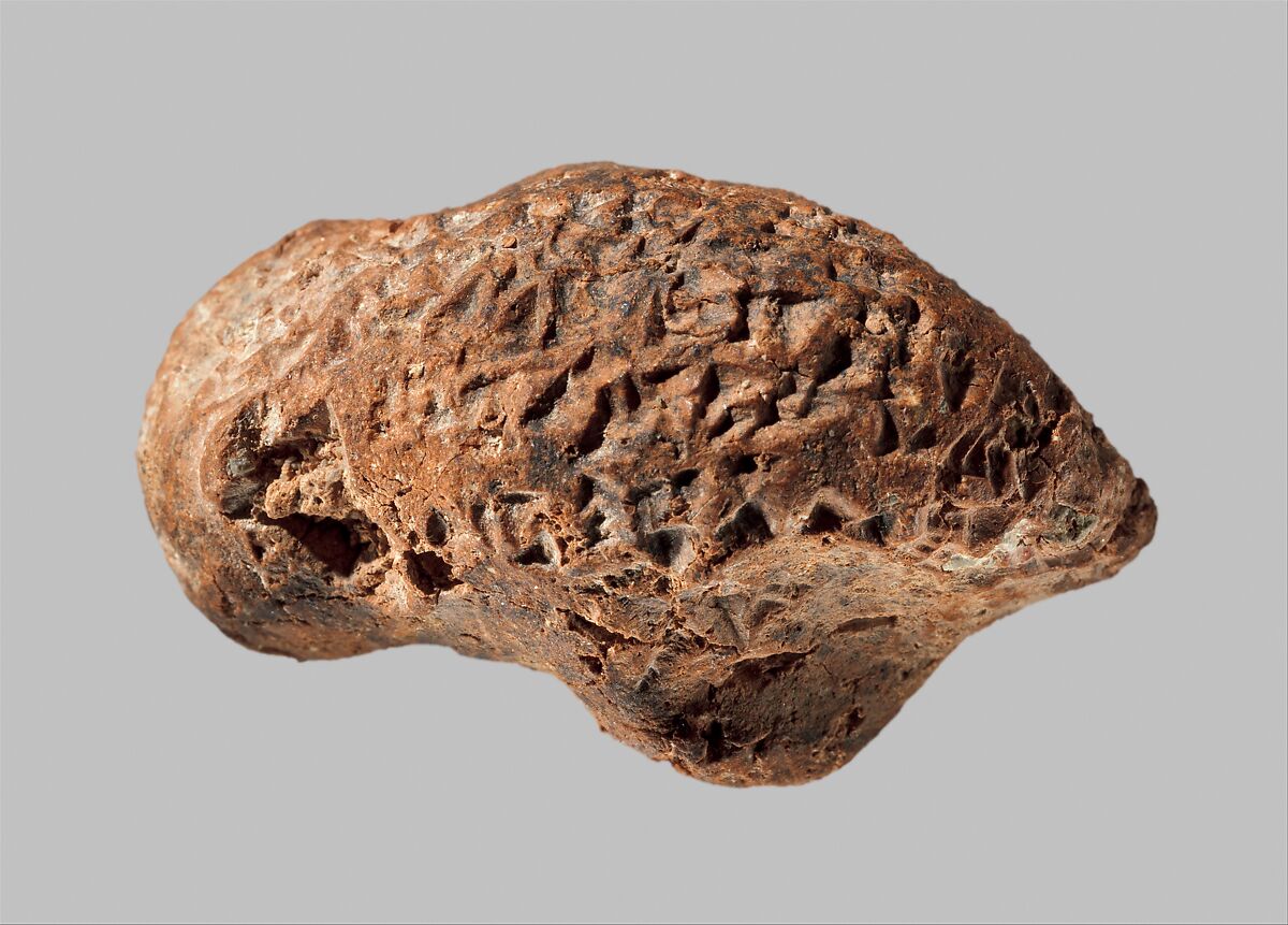 Bird head with inscription of Ashurbanipal, Ceramic, Assyrian