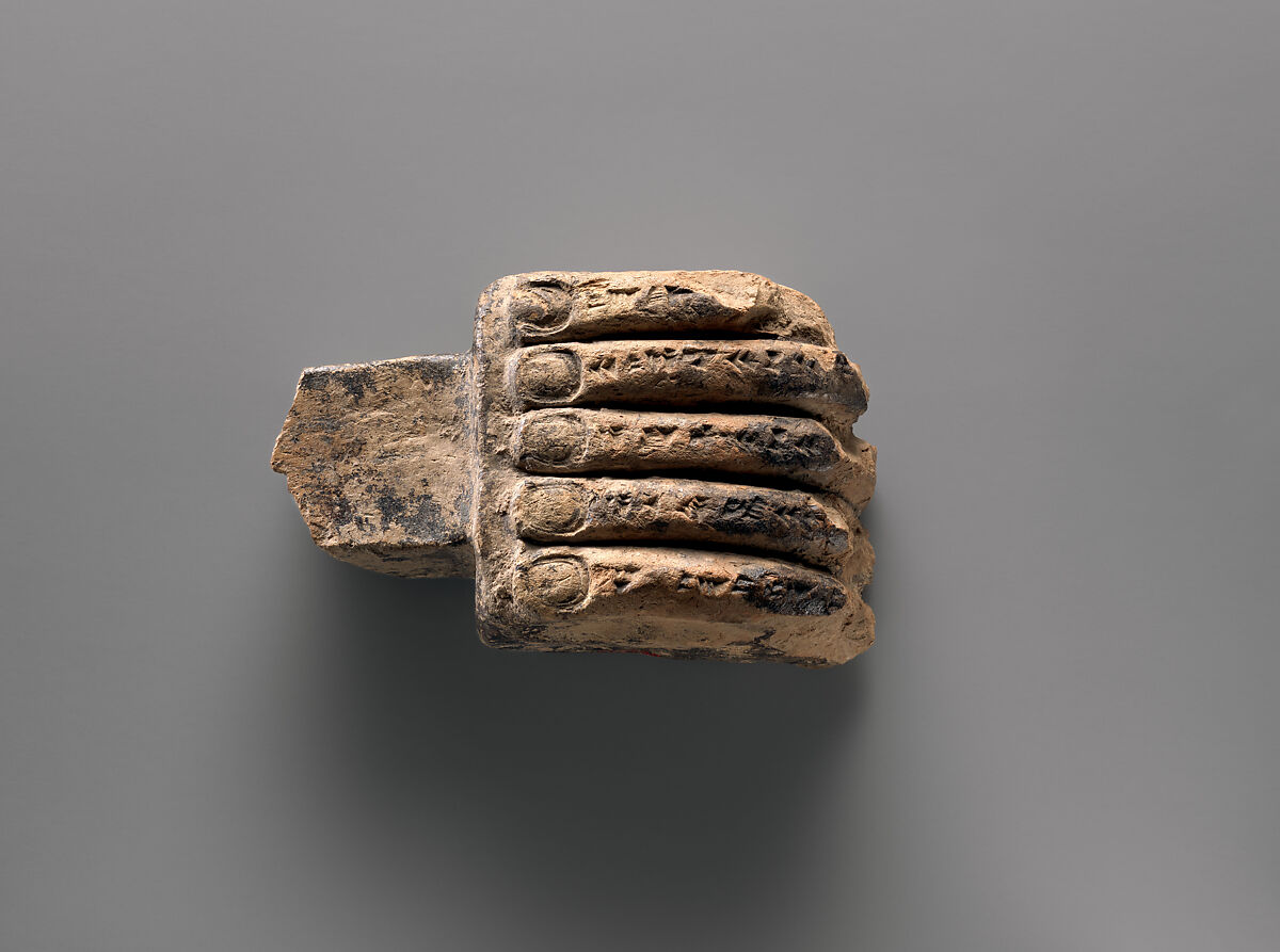 Miniature corbel in the shape of a hand, Ceramic, bitumen, Assyrian