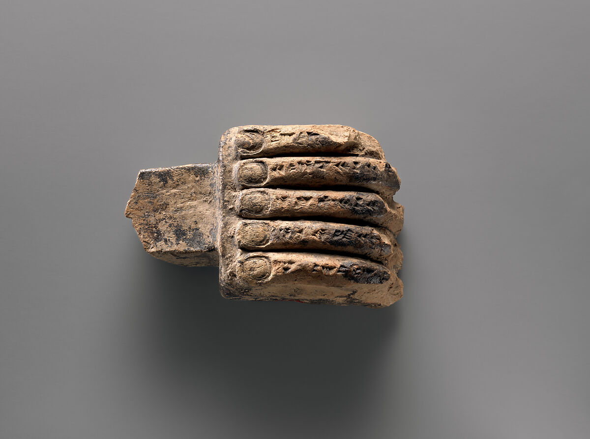 Miniature corbel in the shape of a hand, Ceramic, bitumen, Assyrian 