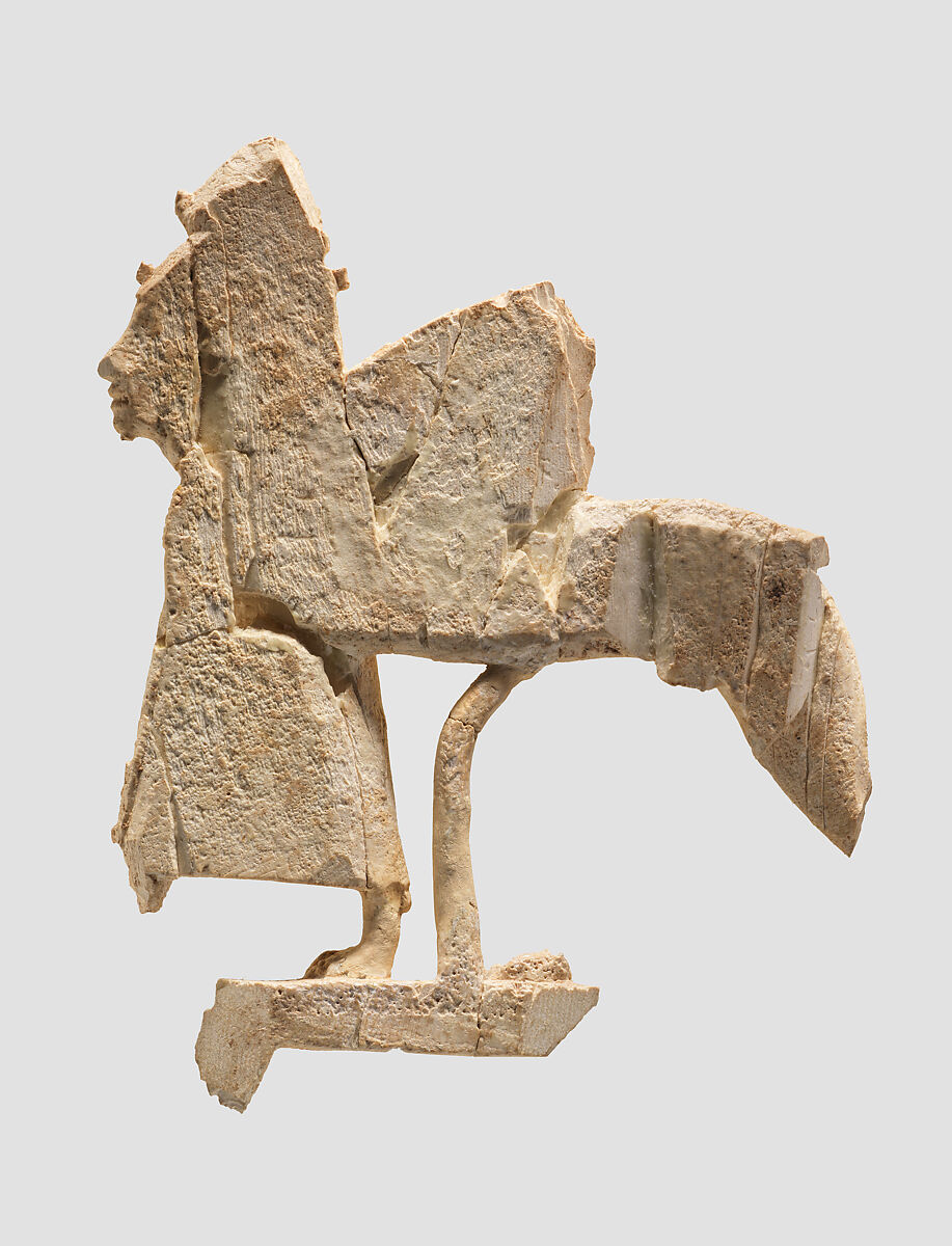 Openwork furniture plaque with a striding sphinx, Ivory, Assyrian