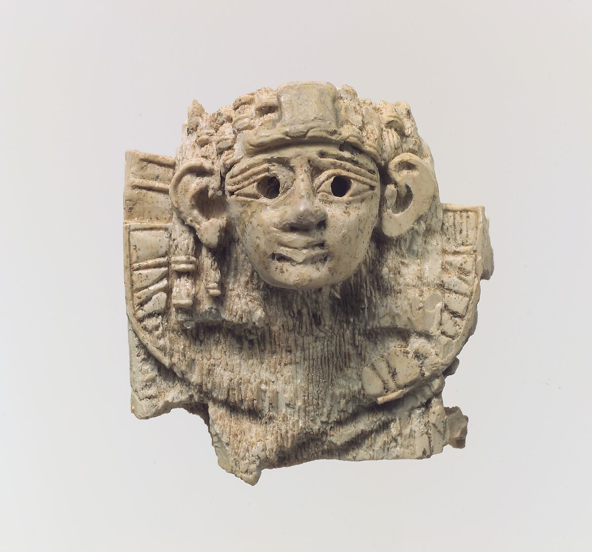 Openwork furniture plaque with head of a sphinx, Ivory, Assyrian 