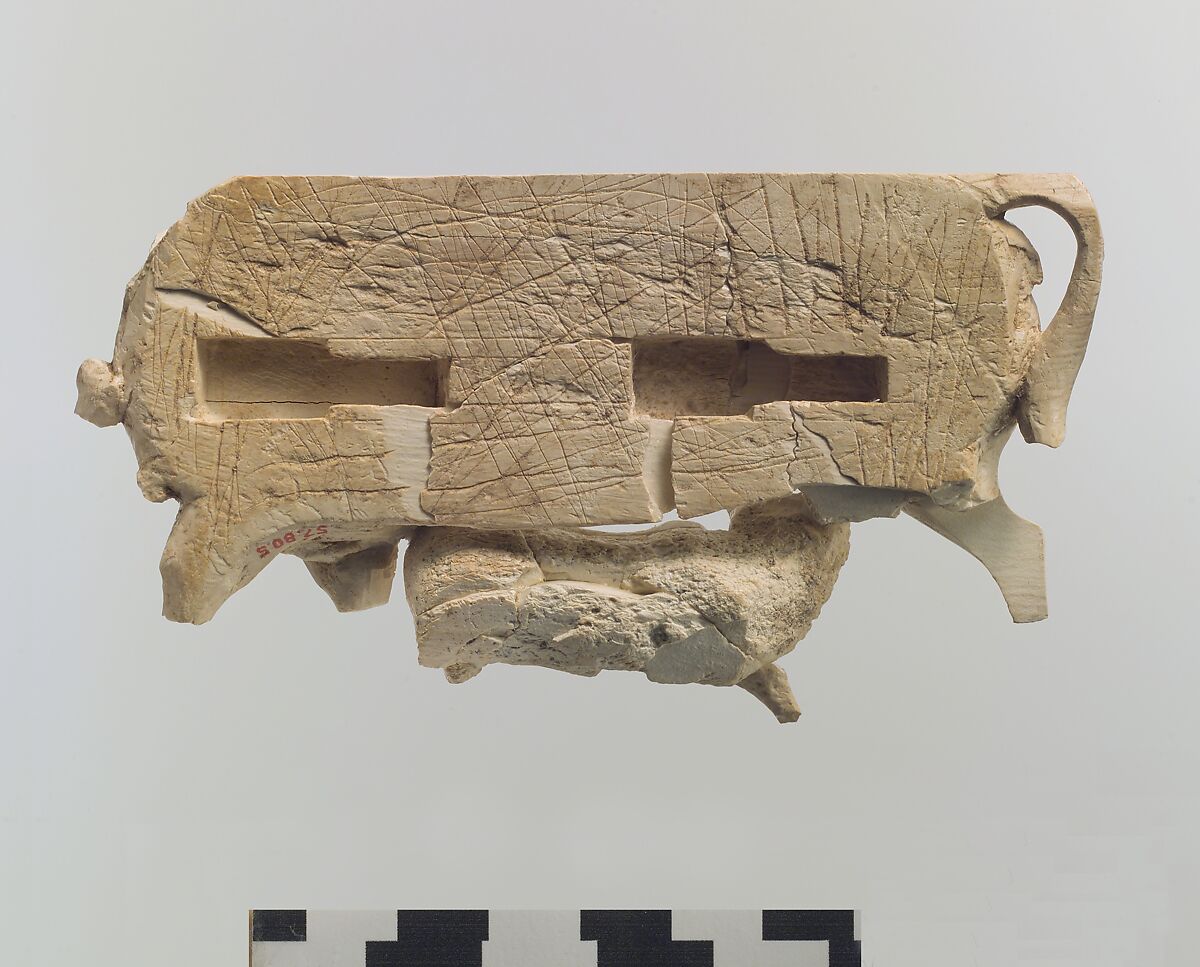 Openwork furniture plaque showing a cow suckling a calf, Ivory, Assyrian