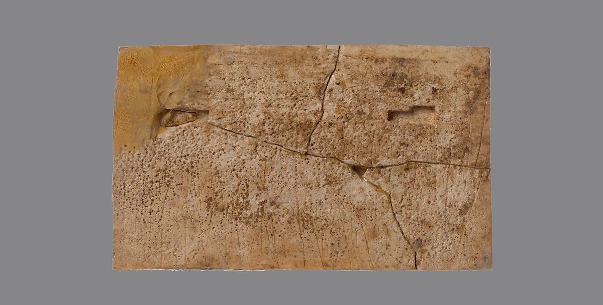 Furniture plaque carved in relief with a cow suckling a calf, Ivory, Assyrian