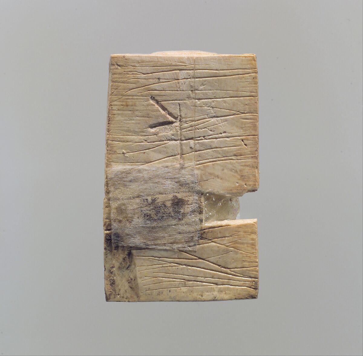 Furniture plaque carved in relief with a “woman at the window”, Ivory, glass, Assyrian