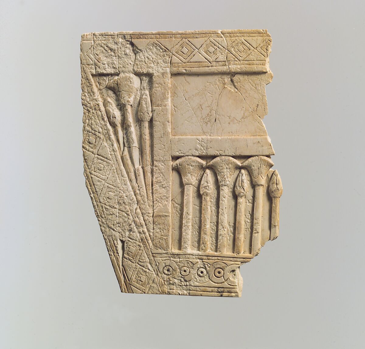 Furniture plaque carved in relief with papyrus buds and flowers, Ivory, Assyrian 