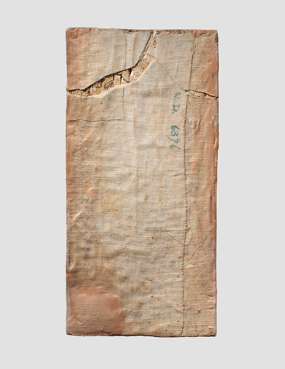 Furniture plaque carved in relief with striding man, Ivory, Assyrian