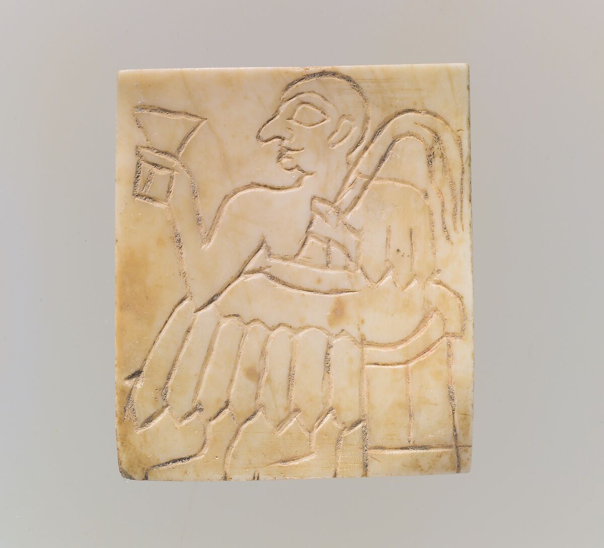 Inlay: seated male with cup and palm frond, Shell, Sumerian 
