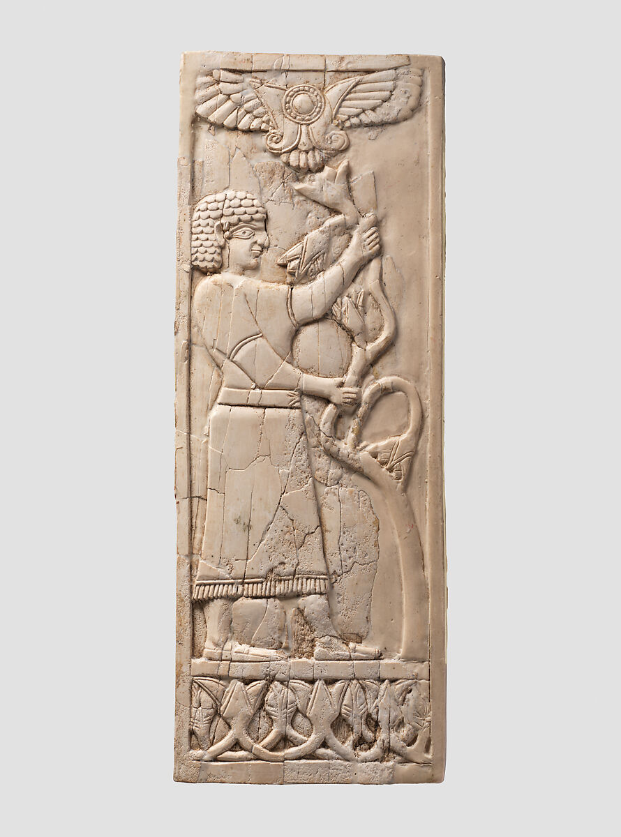Panel with a youth grasping a tree; winged sun disc above, Ivory, Assyrian 