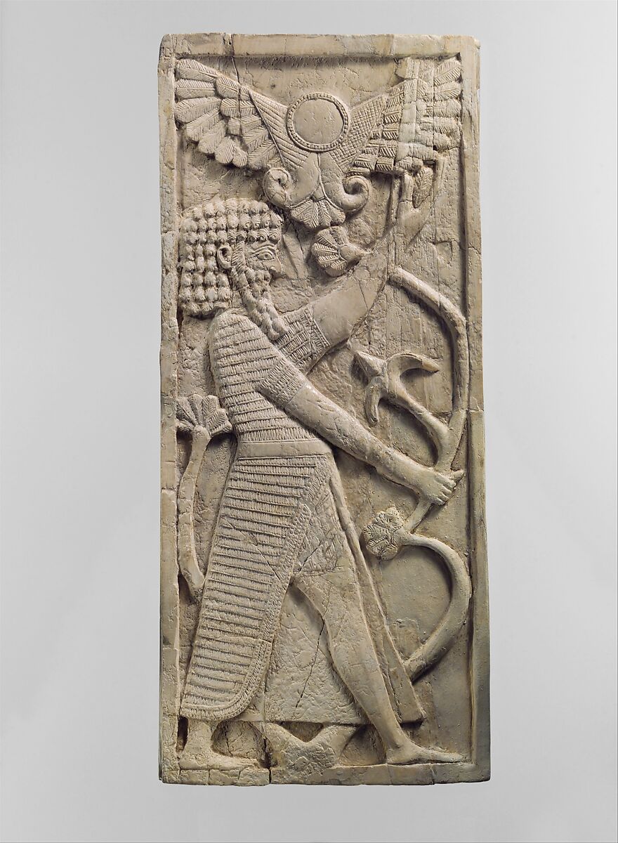 Furniture plaque carved in relief with a male figure grasping a tree; winged sun disc above, Ivory, Assyrian 